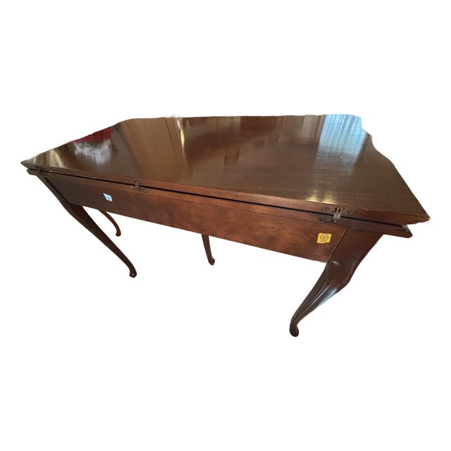 A handsome and unusually well-engineered Federal Revival mahogany convertible extension table, designed to serve as a...
