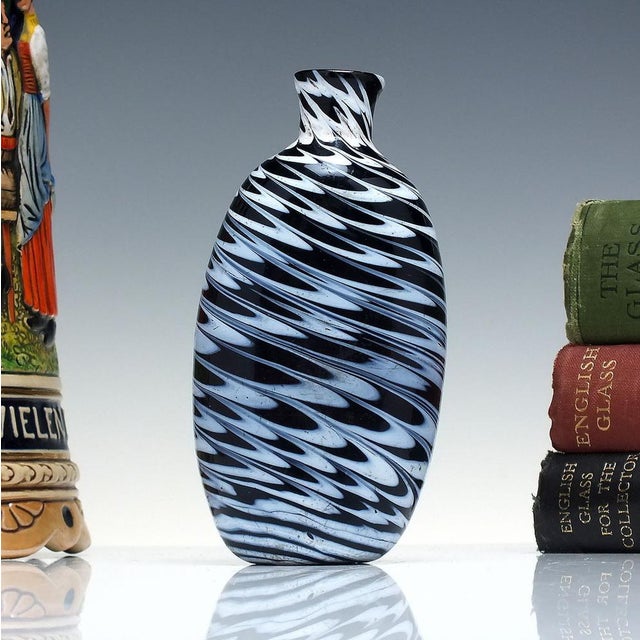 Technical A superb late 18th century Nailsea type glass flask or bottle. It is an amber/dark red in colour (which looks...