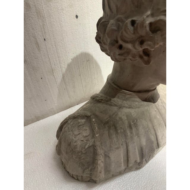 Sculpted plaster cast Representation of a young man's bust Good condition Dimensions: H 37 x W 42 x D 17 cm 20th century