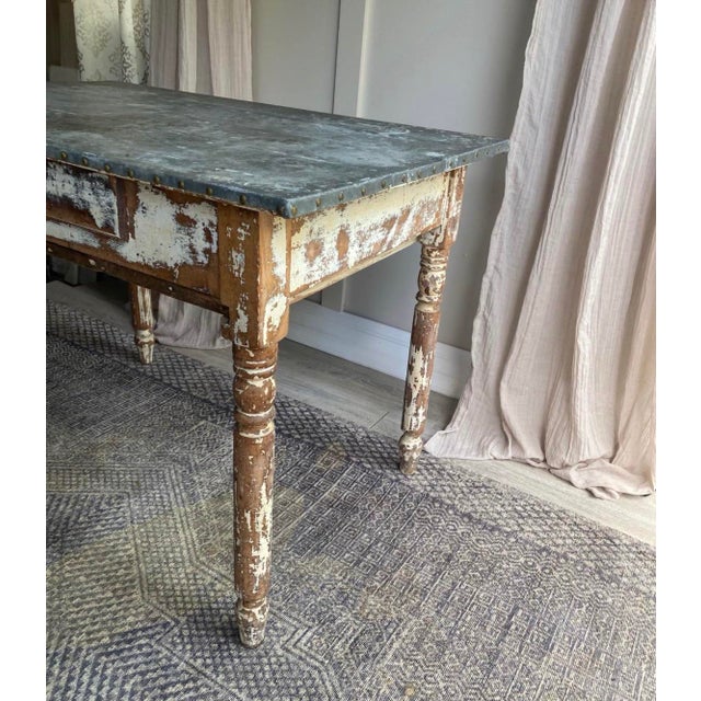 Gorgeous wood table from France, circa early 1900s. Beautiful patina and solid construction. Can be used as a dining...