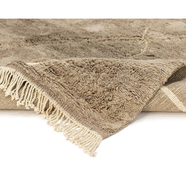Elegant hand-knotted wool rug with a handwoven abstract pattern in Ivory on a Velvet Fawn and Misty Taupe backdrop,...