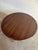This beautiful oval dining table displays a highly streamlined form featuring tapered legs and a hidden center expansion...