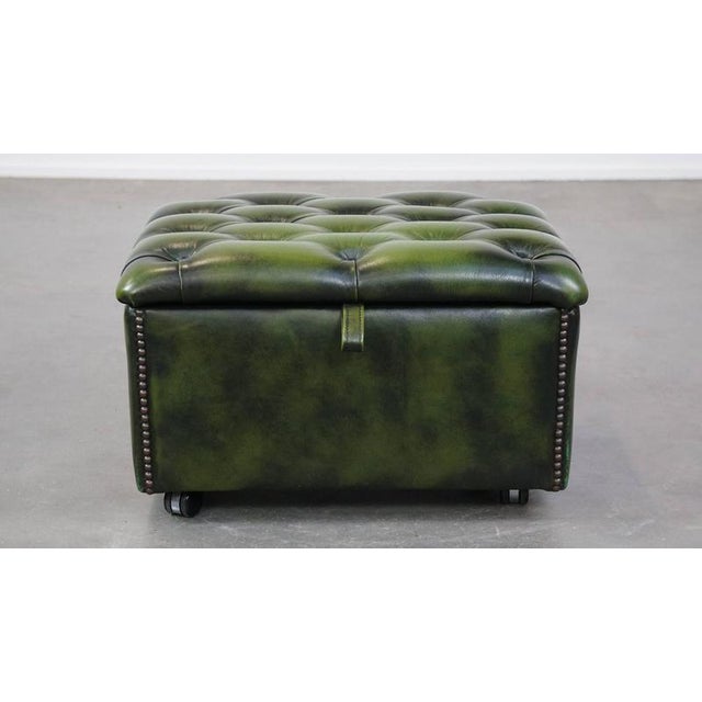 Green cowhide chesterfield ottoman/storage ottoman with wheels. A cowhide footstool, also called an ottoman, turns your...