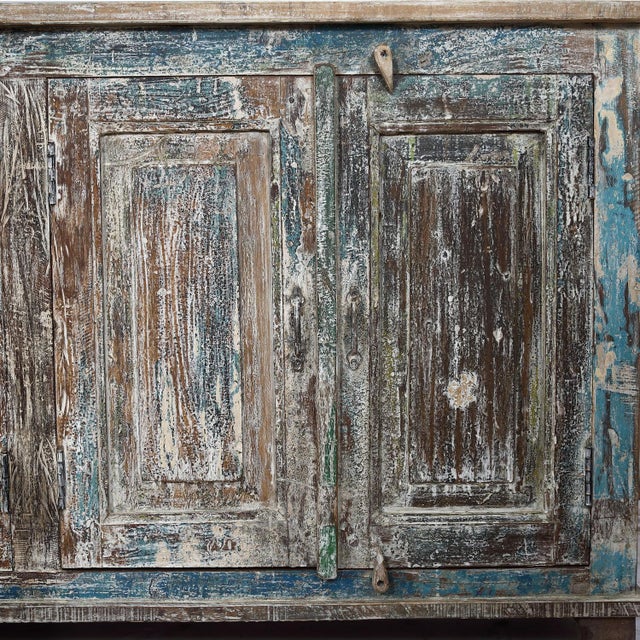 Sideboard/buffet made from Antique Indian Teakwood Architectural Elements, the natural teak panels and case showing traces...