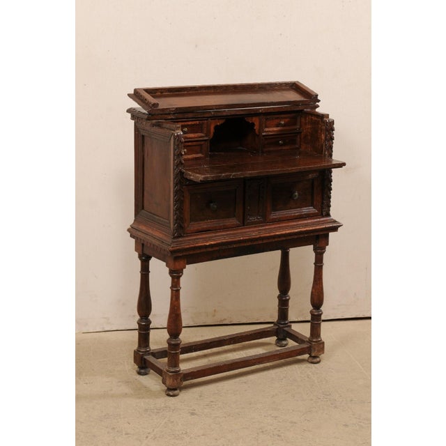 An Italian Butler's Desk from the 18th Century raised on later base. This antique case piece from Italy has the appearance...