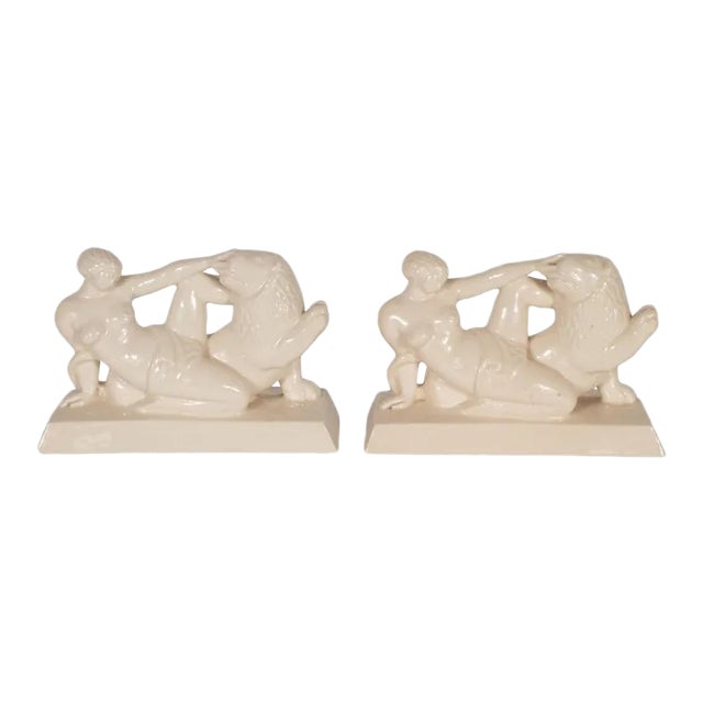 Art Deco Ceramic Book Ends Featuring Lion and Nude Female Figure For Sale