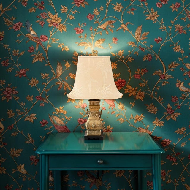An exceptional mid-century modern cast brass table lamp heavily stylized in the iconic Chinoiserie aesthetic of James...