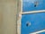 This antique painted chest of drawers in pine is a drawer cabinet with painted fronts and ceramic knobs, on bun feet. It...