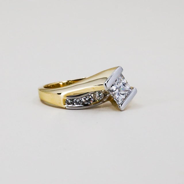 Paul Klecka platinum & 18k engagement ring with matching wedding band. The center stone of the engagement ring is a 0.87...