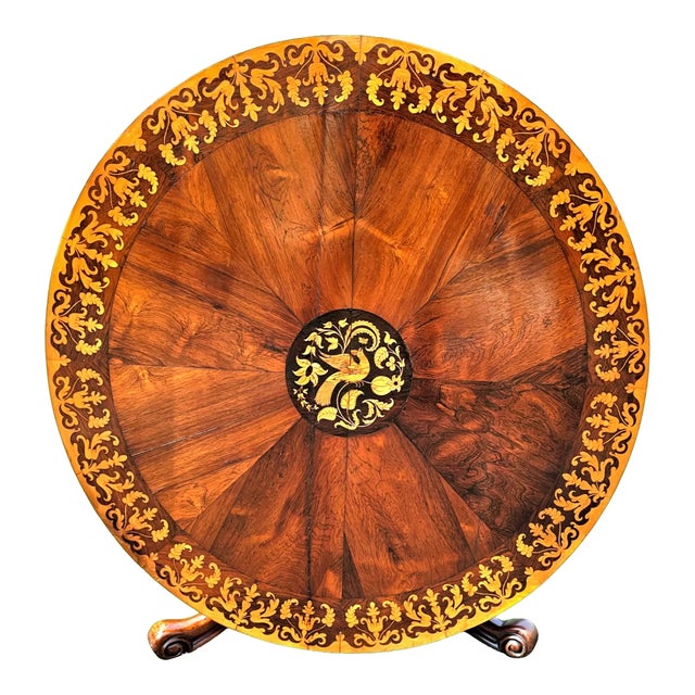 This Victorian Rosewood Tilt-Top Marquetry Coffee Table is a stunning visual marvel of English craftsmanship. The...