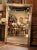 Richly ornamented with delicate floral and fruit motifs, this large antique giltwood mirror is a fine example of French...