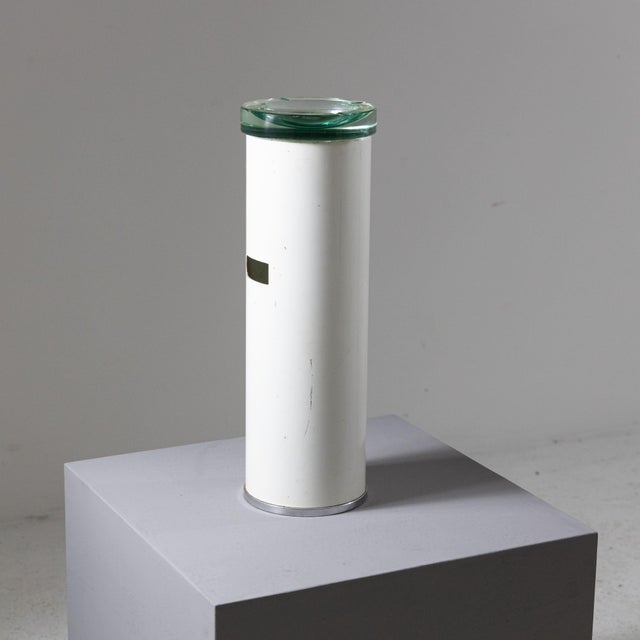 Floor-standing ashtray made from a painted metal frame, illuminated by a Nile green glass top. Patina due to age and use,...