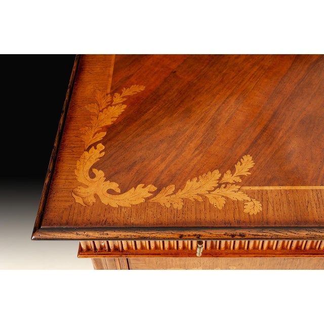 Handcrafted in Italy, this sideboard is crafted from solid walnut and features beautifully inlaid marquetry on the doors...