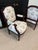 A refined pair of carved wood frames with fluted legs and classic French detailing. Newly upholstered in Colefax & Fowler...