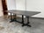 Design Plus Gallery presents the Tye Dining Table by Christophe Decourt. The perpendicular asymmetry of the leg design...