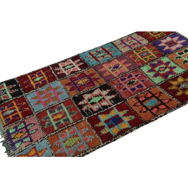Hand-knotted in wool circa 1950-1960, this vintage 4x8 Moroccan rug is believed to hail from the Azilal tribe. On the...