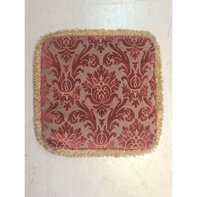 Pairs of vintage feather-filled chair cushions upholstered in an elegant burgundy and taupe damask fabric. The richly...