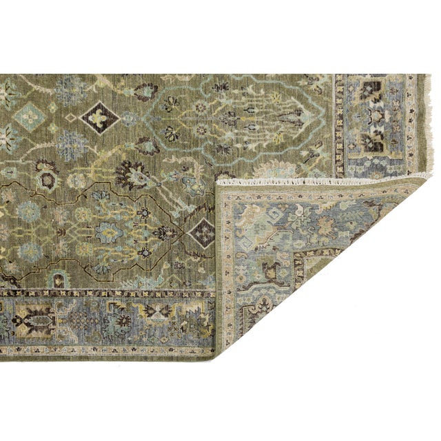 A bold reinterpretation of classic Persian design, this modern Heriz-style rug is hand-knotted in premium wool. Its...