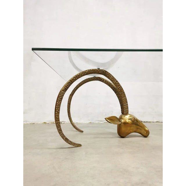 Absolutely stylish alluring \. So can you describe this wonderful French coffee table. Particularly beautiful the brass-...