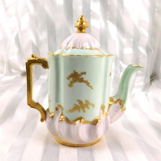 This is a very beautiful small milk jug by Leonard Vienna Austria. It is palest pink and pale mint green with gold trim....