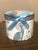 An exquisite Delton Products porcelain "Tea for One" set featuring a striking peacock and botanical motif set against...
