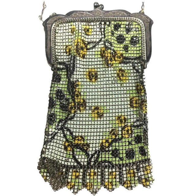 1920's At Deco Flapper mesh purse. It features a kiss-lock clasp and a distinctive "Vandyke" bottom edge. The silver-tone...