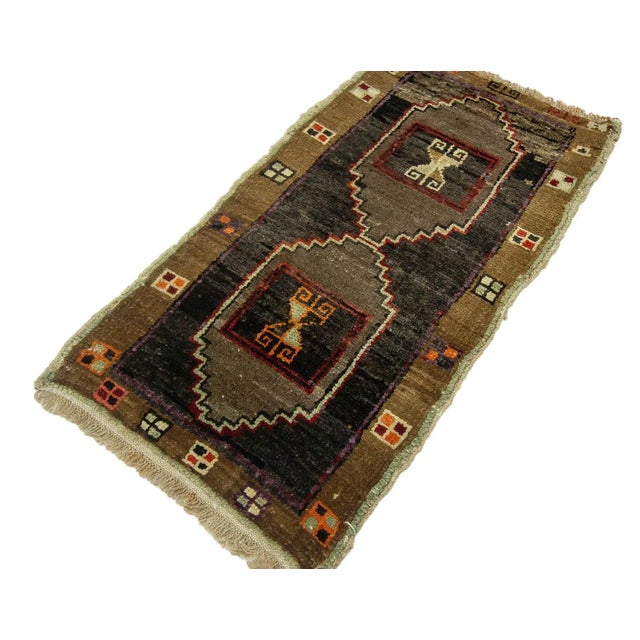 Vintage Handknotted decorative mini rug from Kars region of Turkey. Approximately 45-55 years old. In very good condition.