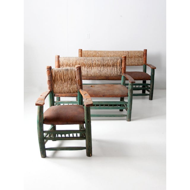 Vintage Mexican Hacienda sofa, loveseat, and armchair set featuring hand-hewn wood frames, woven tule backs, hand-shaped...