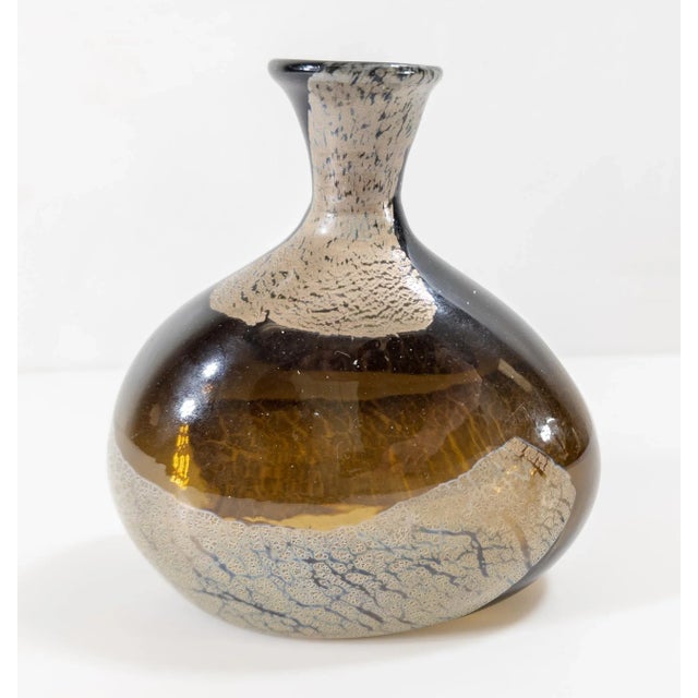 We are selling this interesting Mid-century style art glass vase. This vase has olive glass body like an old bottle with...