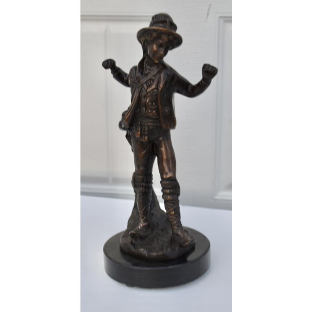 Vintage (1940's) Young Boy Statue has a European Style. Made of Bronze with an Marble Base. The Measurements: 6"W x 5.5"D...