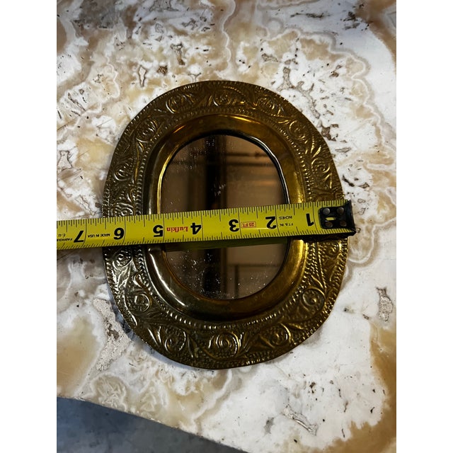 Up for consideration is a beautiful vintage small oval etched brass mirror. This would look lovely in your home, and it is...