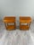 Pair of wooden bedside tables, resting on four turned legs. Each table features a drawer on the front, adorned with a...