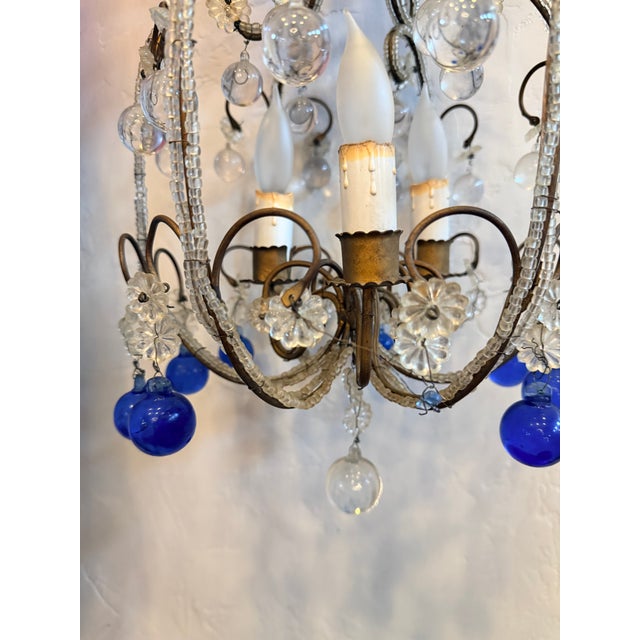 Precious 19th century chandeliers with deep blue and clear crystal pendents with antique brass fittings. One of a stunning...