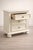 Charming vintage three-drawer nightstand freshly painted in a soft antique white. Solid, well-built construction with...