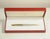 Santos Brushed Steel and 18 Karat Gold-Plated Stylo Bille Must II Ballpoint Pen with Red Box from Cartier, 2000s, Set of 3 For Sale - Image 4 of 15