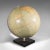 This is a vintage table globe. An English, paper finished world map with chrome meridian, dating to the mid 20th century,...