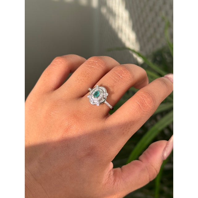 This art deco target ring features a 0.18 carat octagon cut emerald set in 14K white gold. The emerald measuring...