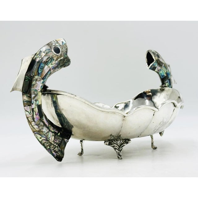 A striking and highly sculptural Mexican silver-plated centerpiece bowl handcrafted in Taxco, Mexico, featuring an...