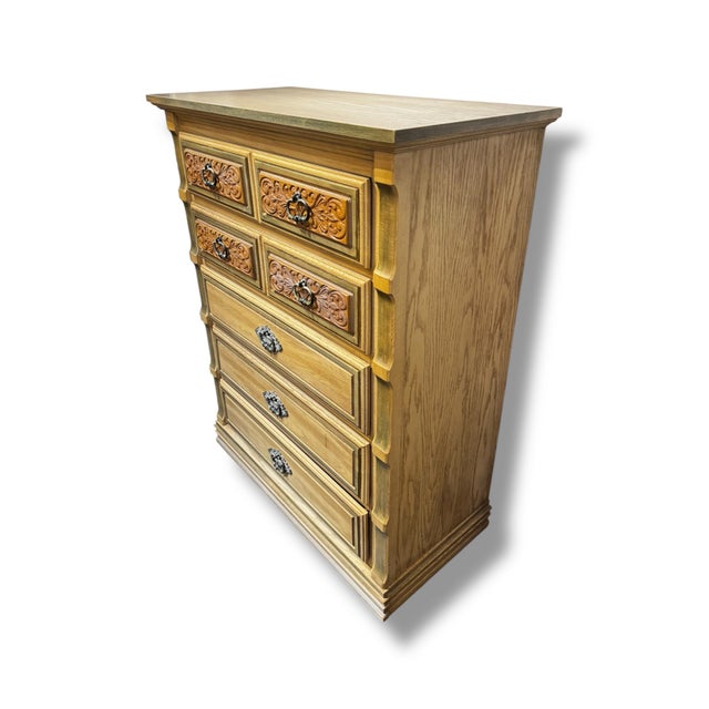 Beautiful vintage dresser featuring a warm oak finish, carved drawer fronts, and classic Mediterranean-inspired detailing...