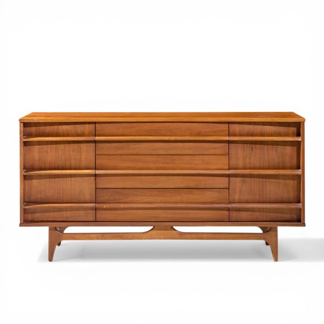 Young Manufacturing Mid Century Walnut Curved Front Credenza This credenza measures: 64 wide x 19 deep x 32.5 inches high...