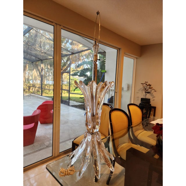 This listing consists of a beautiful hige midcentury modern murano sculpture lamp in clear glass and free form. It's...