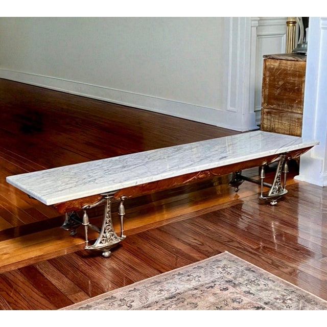 Offering an exceptional French tabletop buffet server of gilded cast iron, clad in hammered copper with a white marble...