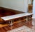 Offering an exceptional French tabletop buffet server of gilded cast iron, clad in hammered copper with a white marble...