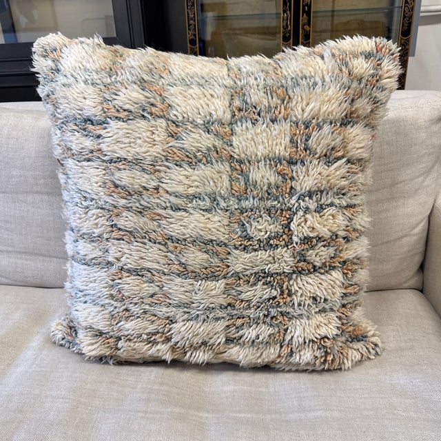 Design Plus Gallery presents a Moroccan Style Shag Accent Pillow. It has an ivory high pile front patterned in muted blue...
