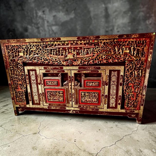 Magnificent carved 2 door cabinet with figures & various foliage covering entire front. Having well decorated sides and...
