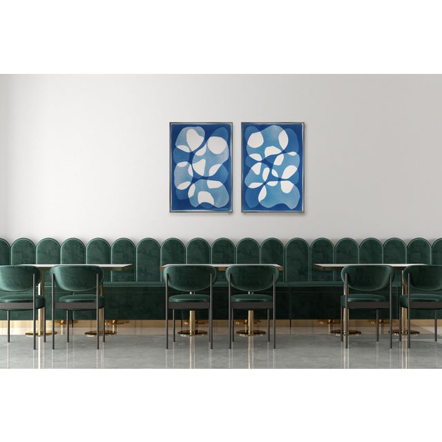 This unique monotype cyanotype explores rhythm and transparency through layered organic forms set against deep ultramarine...