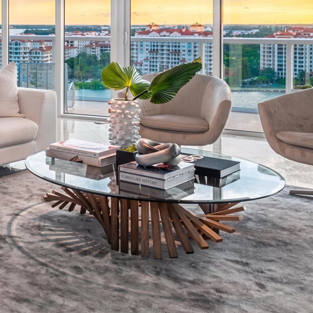 Designed by Vito Selma for Oggetti, the Remini Coffee Table pairs organic fluid forms with clear architectural glass. Its...