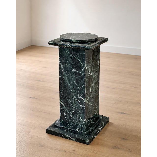A beautifully crafted custom marble display pedestal, handcrafted by an Italian stone artisan in Los Angeles from richly...