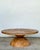 This striking coffee table is a masterclass in Organic Modern design, featuring a unique "puzzle wood" construction that...