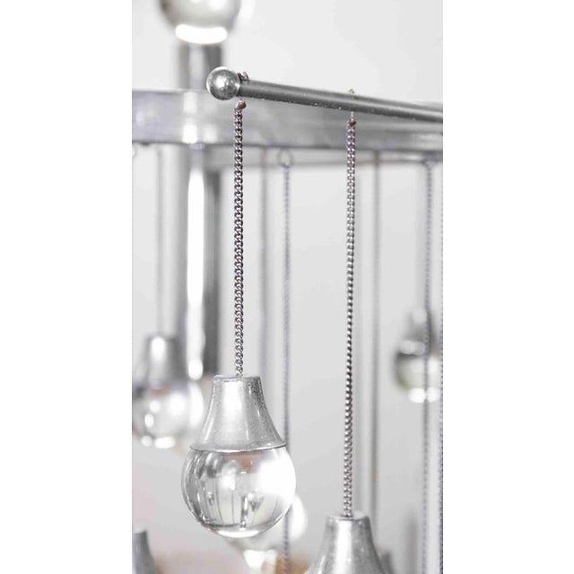 Chandelier Lamp is a design lamp realized by Gaetano Sciolari in 1970s. Glass and Chromed Metal Good conditions. Up to...